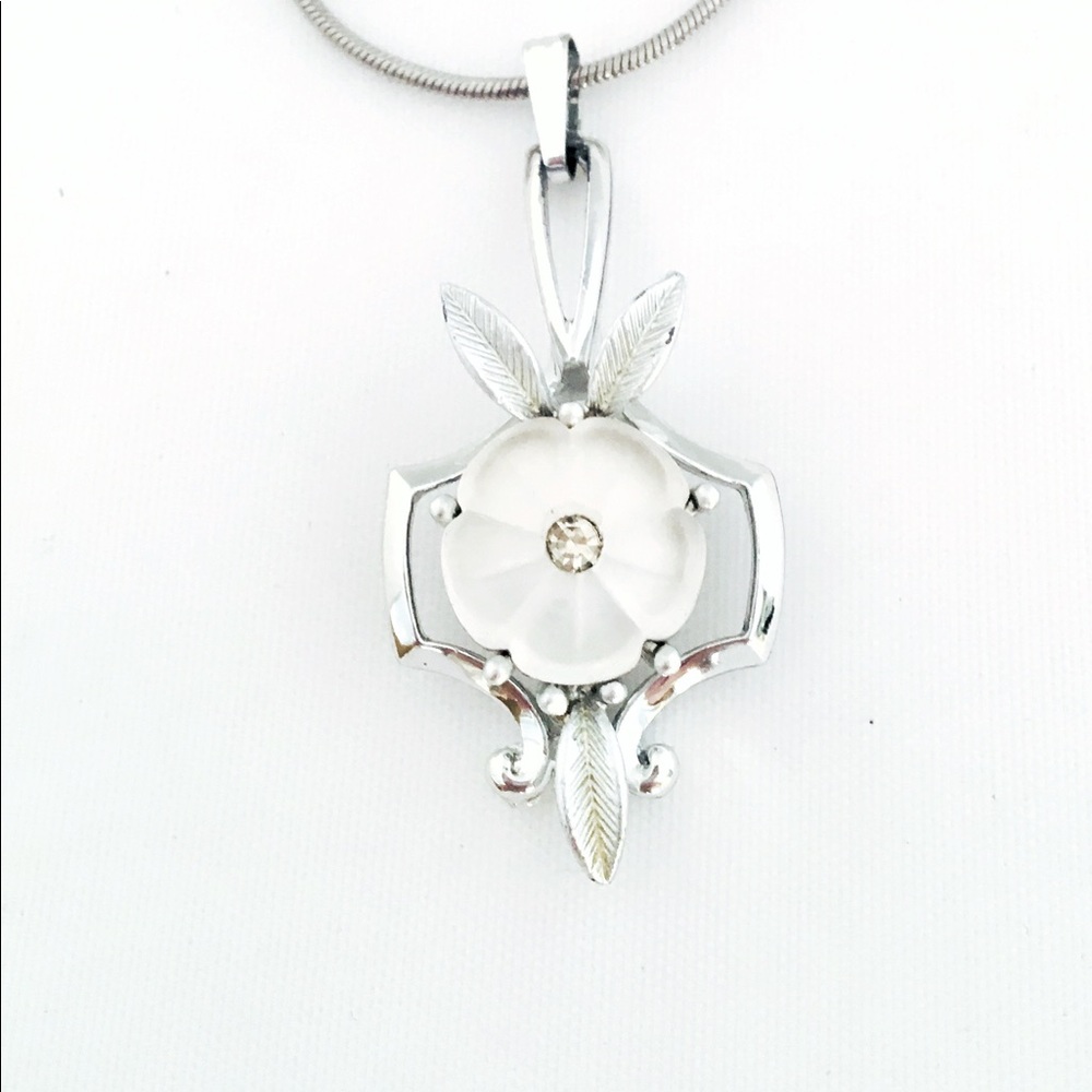 Vintage pendant on new sterling plated chain.